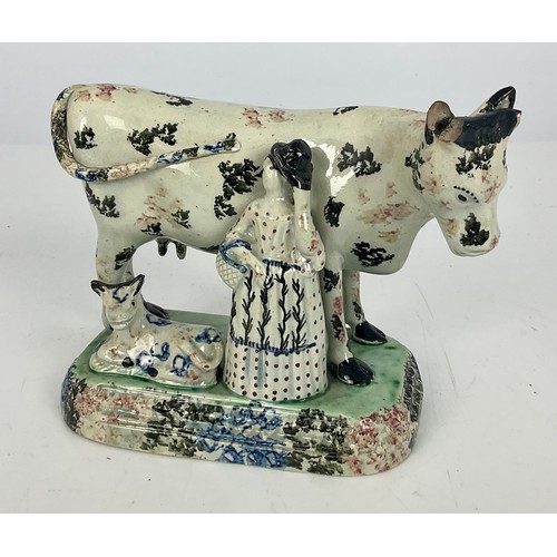 31 - EARLY 19TH CENTURY CREAMWARE COW GROUP WITH MILKMAID AND CALF IN THE THOMAS WHEILDON STYLE