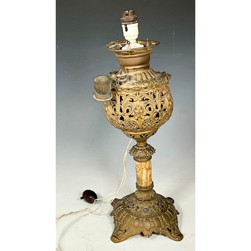 261 - PIERCED METAL CONVERTED OIL TABLE LAMP. HEIGHT APPROX. 50cm