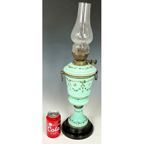 260 - FRENCH GLASS OIL LAMP WITH ENAMELLED FLORAL DECORATION. HEIGHT APPROX. 60cm