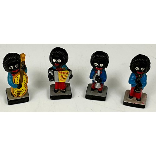 380 - FOUR ROBERTSON POTTERY GOLLY CHARACTERS WITH MUSICAL INSTRUMENTS