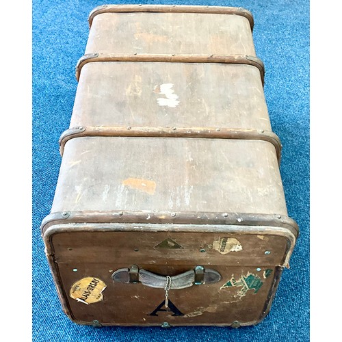 397 - EARLY 20TH CENTURY BROWN CANVAS BOUND STEAMER TRUNK WITH TREEN STRAPWORK. Approx. 90cm x 55cm x 47cm... 