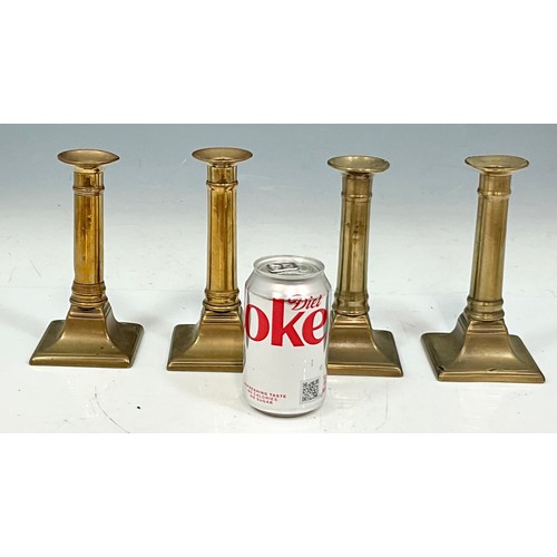 288 - SET OF FOUR BRASS CANDLESTICKS WITH PUSHERS