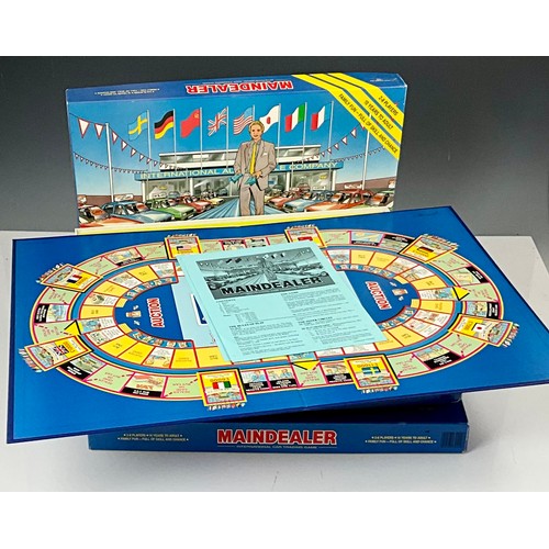 28 - 3 BOXED ‘MAINDEALER’ BOARD GAMES. INTERNATIONAL CAR TRADING GAME. MINT GAMES LTD 1987