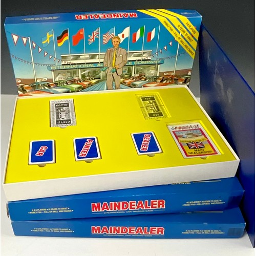 28 - 3 BOXED ‘MAINDEALER’ BOARD GAMES. INTERNATIONAL CAR TRADING GAME. MINT GAMES LTD 1987