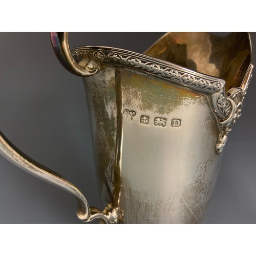 249 - HALLMARKED SILVER HARRODS BIRMINGHAM 1928 ORNATE HELMET SHAPED CREAMER 228g