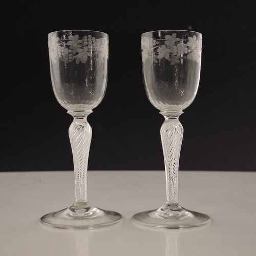 74 - PR. WINE GLASSES WITH INVERTED BALUSTER AIR TWIST STEMS AND BOWLS ENGRAVED WITH FRUITING VINE, APPRO... 