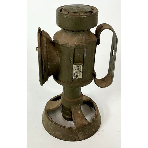 148 - HAND HELD MILITARY LAMP STAMPED PLCO 1944 WITH CROWS FOOT AND HINGED SLIT SHADE