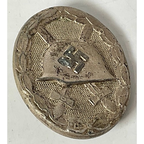 158 - 2 GERMAN THIRD REICH MERIT BADGES AND A WOUND BADGE- important, these are sold strictly as seen, aut... 