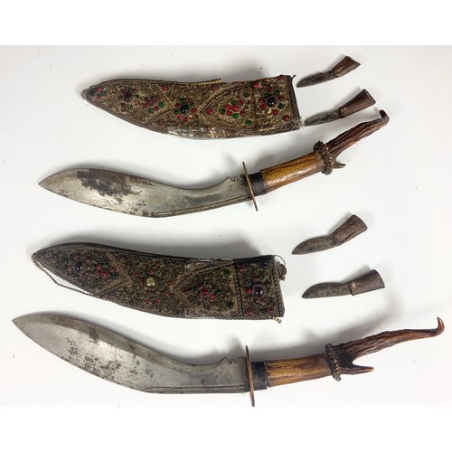 130 - 2 ANTLER HANDLED KUKRI EACH WITH A JEWEL ENCRUSTED SHEATH