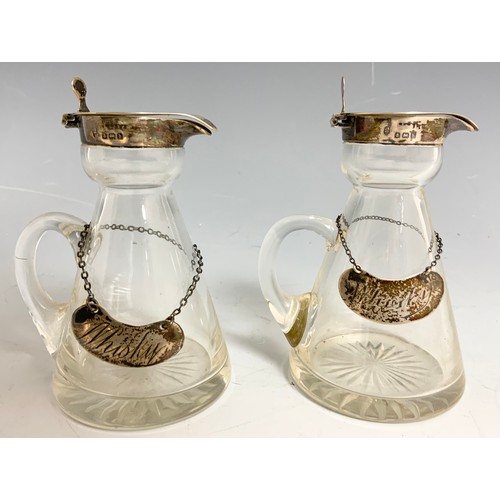 75 - A MATCHING PAIR OF WHISKY NOGGINS EACH WITH A SILVER HINGER COVER AND EACH HAVING A SILVER WHISKY LA... 