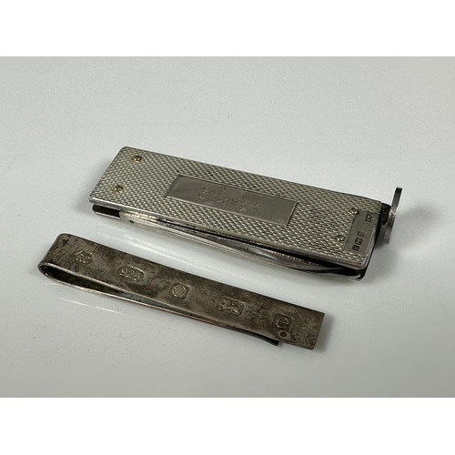 297 - SILVER CIGAR CUTTER INSCRIBED GEORGE TOGETHER WITH A SILVER MONEY CLIP, APPROX. 40g