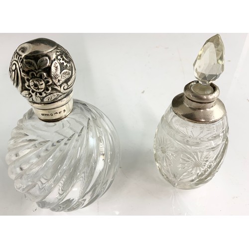 305 - WRYTHEN GLASS DRESSING TABLE BOTTLE WITH EMBOSSED SILVER TOP AND ONE OTHER