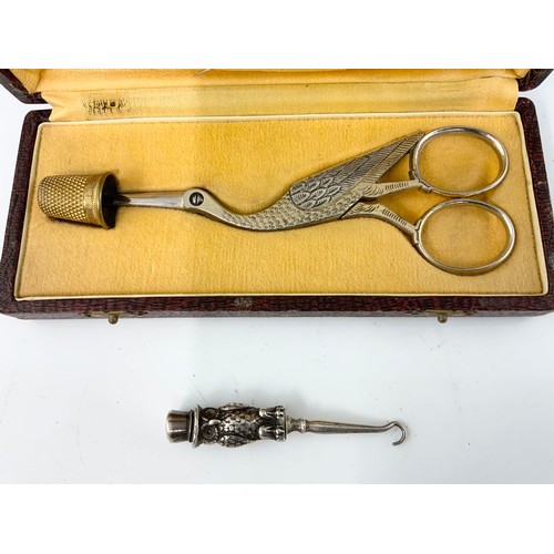 367 - PR. STORK FORM NOVELTY RIBBON SCISSORS AND THIMBLE IN FITTED CASE TOGETHER WITH AN OWL BUTTON HOOK