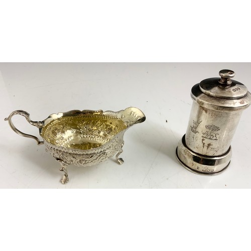 251 - HALLMARKED SILVER PEPPER GRINDER WITH A GOOD QUALITY SILVER CREAM JUG WITH RUBBED MARKS  305g GROSS