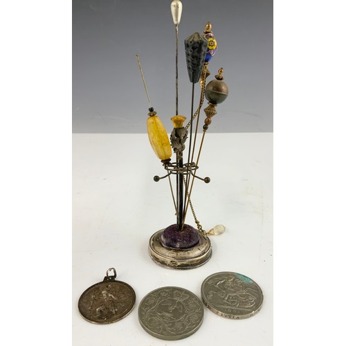 365 - SILVER HATPIN STAND AND PINS, 1951 CROWN, COMMEMORATIVE CROWN AND A SILVER ST.CHRISTOPHER