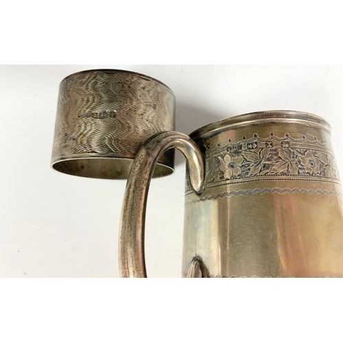 287 - SILVER CHRISTENING TANKARD WITH INSCRIPTION AND A SILVER SERVIETTE RING WITH ENGINE TURNED DECORATIO... 