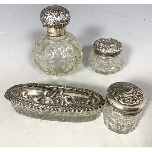 303 - SILVER TOP CUT GLASS PERFUME BOTTLE AND OTHER DRESSING TABLE ITEMS WITH SILVER TOPS TOGETHER WITH 2 ... 