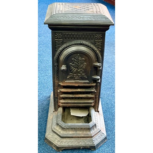 494 - HEAVY CAST IRON FIRE STOVE WOOD BURNER. SOME CRACKING TO BASE. 73cm HIGH