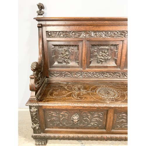 589 - IMPRESSIVE CARVED OAK SETTLE WIDTH 161cm , 145cm TALL