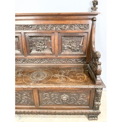 589 - IMPRESSIVE CARVED OAK SETTLE WIDTH 161cm , 145cm TALL