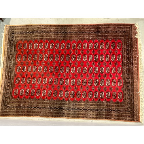 681 - LARGE RED GROUND CARPET / RUG 330cm x 220cm