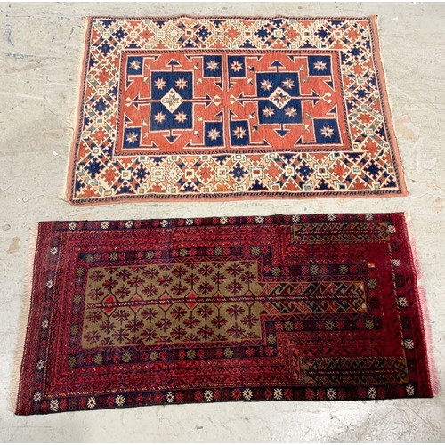 686 - 2 RED GROUND RUGS LARGEST136cm x 98cm