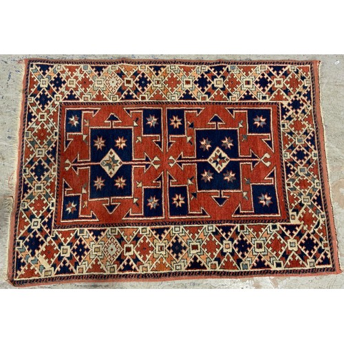 686 - 2 RED GROUND RUGS LARGEST136cm x 98cm