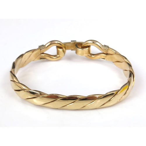 543 - VERY COMMERCIAL HEAVY 9ct GOLD BANGLE IN THE FORM OF A HORSE’S BIT IN FITTED G.L.BICKNELL BOX, APPRO... 