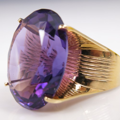 606 - MASSIVE OVAL CUT AMETHYST SET AS A RING ON A 14K 585 BAND, STONE APPROX. 25 X 18 mm