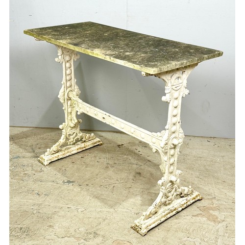 514 - WELL WEATHERED MARBLE TOP TABLE ON CAST IRON BASE, TOP APPROX. 91 X 42 cm