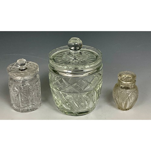 226 - LIDDED CUT GLASS BISCUIT BARREL, PRESERVE JAR WITH COVER AND A CUT GLASS BOTTLE