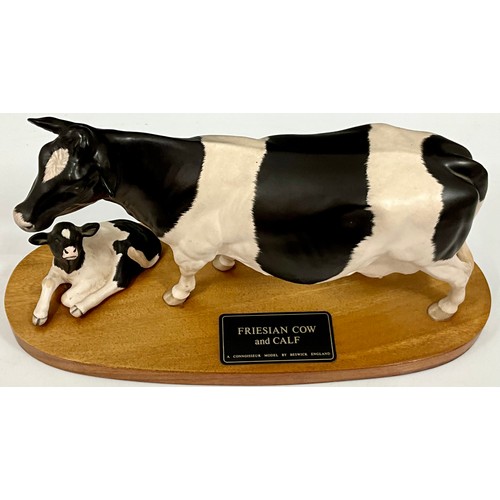 95 - BESWICK CONNOISSEUR ROYAL DOULTON FREISAN COW AND CALF ON PLINTH