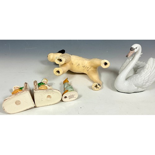 125 - MISC. CHINA AND PORCELAIN INCLUDING A BEATRIX POTTER FIGURE, PAIR OF FIGURAL BOOKENDS, DOG AND SWAN ... 