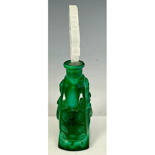 210 - AN ART DECO CARVED MALACHITE SCENT BOTTLE, EACH OVAL CARTOUCHE WITH SEATED FEMALE NUDE, CLEAR CUT