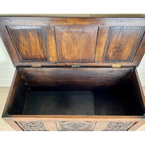 592 - CARVED OAK CHEST 103cm L x 47cm D x 53cm H