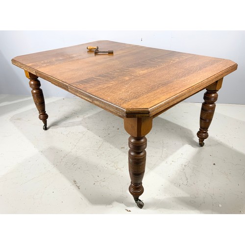 557 - OAK EXTENDING DINING TABLE  150cm x 105cm WITH HANDLE