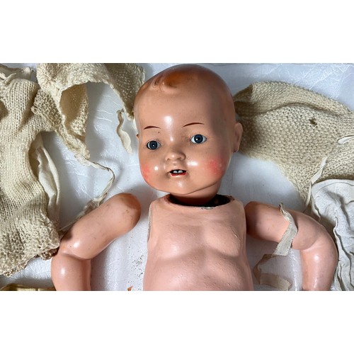 424 - A PAINTED CHINA HEADED GERMAN BOY BABY DOLL, IMPRESSED MARKS TO REVERSE OF HEAD HW GERMANY 4 IN NEED... 