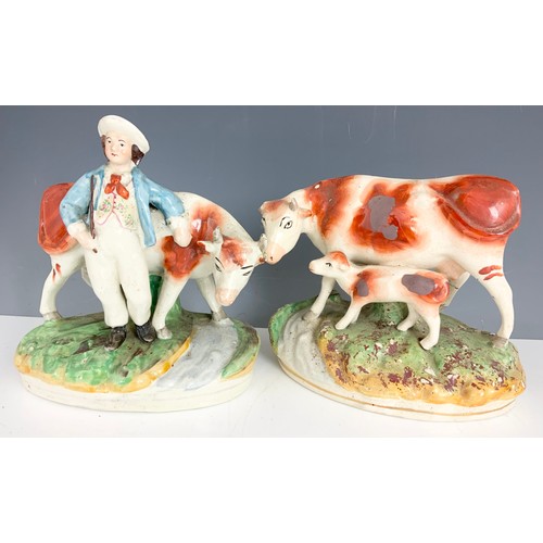 171 - STAFFORDSHIRE COW. MODELS, GOEBEL BOOKENDS , 2 CAST METAL MODELS, & A RESIN HORSE MODEL