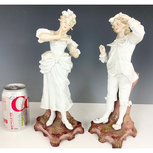 172 - PAIR OF CONTINENTAL FIGURES AND A STAFFORDSHIRE FIGURE