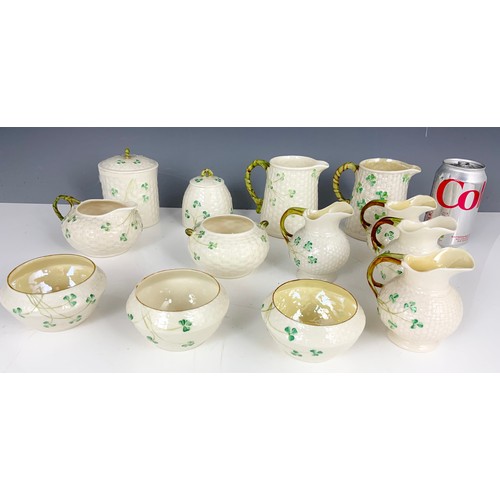 189 - COLLECTION OF BELLEEK BASKET WEAVE WITH SHAMROCK PATTERN JUGS, DISHES BOWLS ETC