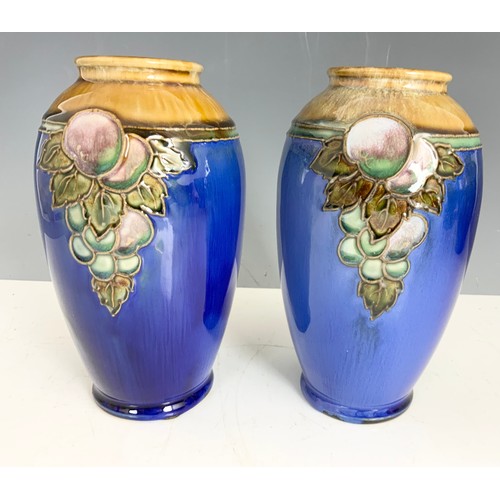 233 - PAIR OF  ROYAL DOULTON BLUE GROUND VASES WITH TUBE LINED FRUIT DECORATION 19cm TALL