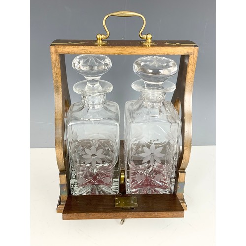 262 - OAK TANTALUS WITH TWO FLORAL ENGRAVED DECANTERS