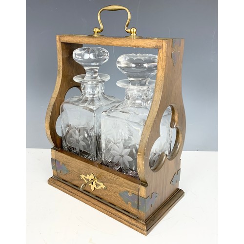 262 - OAK TANTALUS WITH TWO FLORAL ENGRAVED DECANTERS