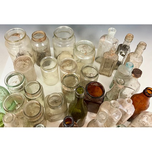 275 - TRAY OF VINTAGE GLASS PRODUCE AND MEDICINAL JARS AND BOTTLES