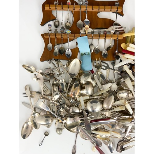 303 - LARGE QUANITY OF MIXED CUTLERY , SILVER PLATED , SOUVENIR SPOONS ETC