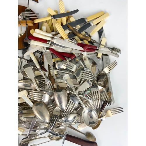 303 - LARGE QUANITY OF MIXED CUTLERY , SILVER PLATED , SOUVENIR SPOONS ETC