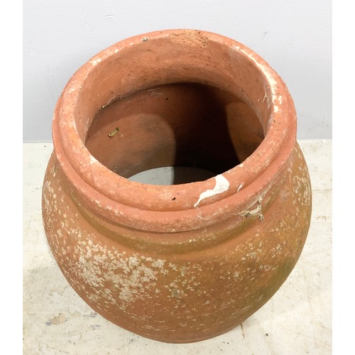 493 - TERRACOTTA  FORCER 33cm TALL WITH  A GARDEN URN 42cm TALL