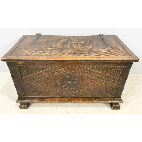 554 - CARVED OAK BOX WITH STRAP HINGES WITH CARVED GALLEON DECORATION WIDTH 81cm