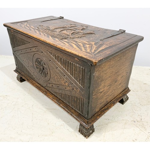 554 - CARVED OAK BOX WITH STRAP HINGES WITH CARVED GALLEON DECORATION WIDTH 81cm