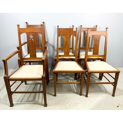 662 - SET OF SIX (FOUR PLUS TWO CARVERS) ARTS AND CRAFTS STYLE OAK DINING CHAIRS WHICH WE ARE ADVISED WERE... 